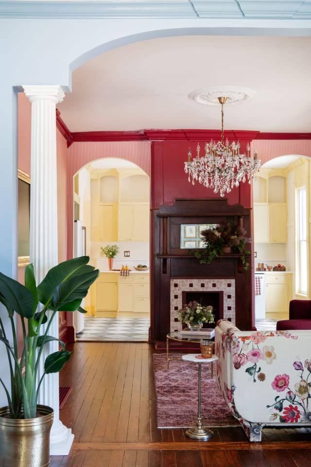 The Parlour with chandelier, looking through arches into the Butter Kitchen